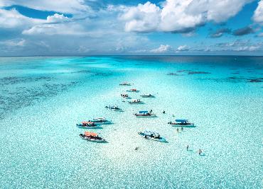 boats in turquoise Indian Ocean in Zanzibar